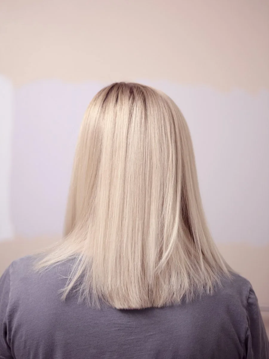 Platinum blonde hair, blunt cut