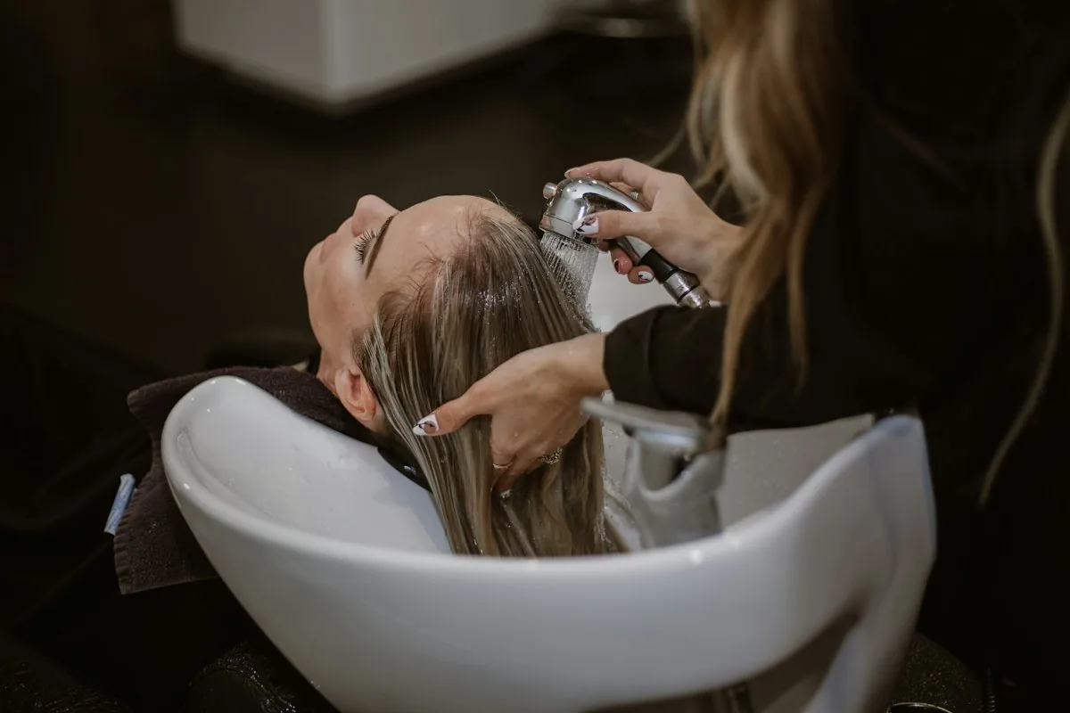 Client at a salon wash basin