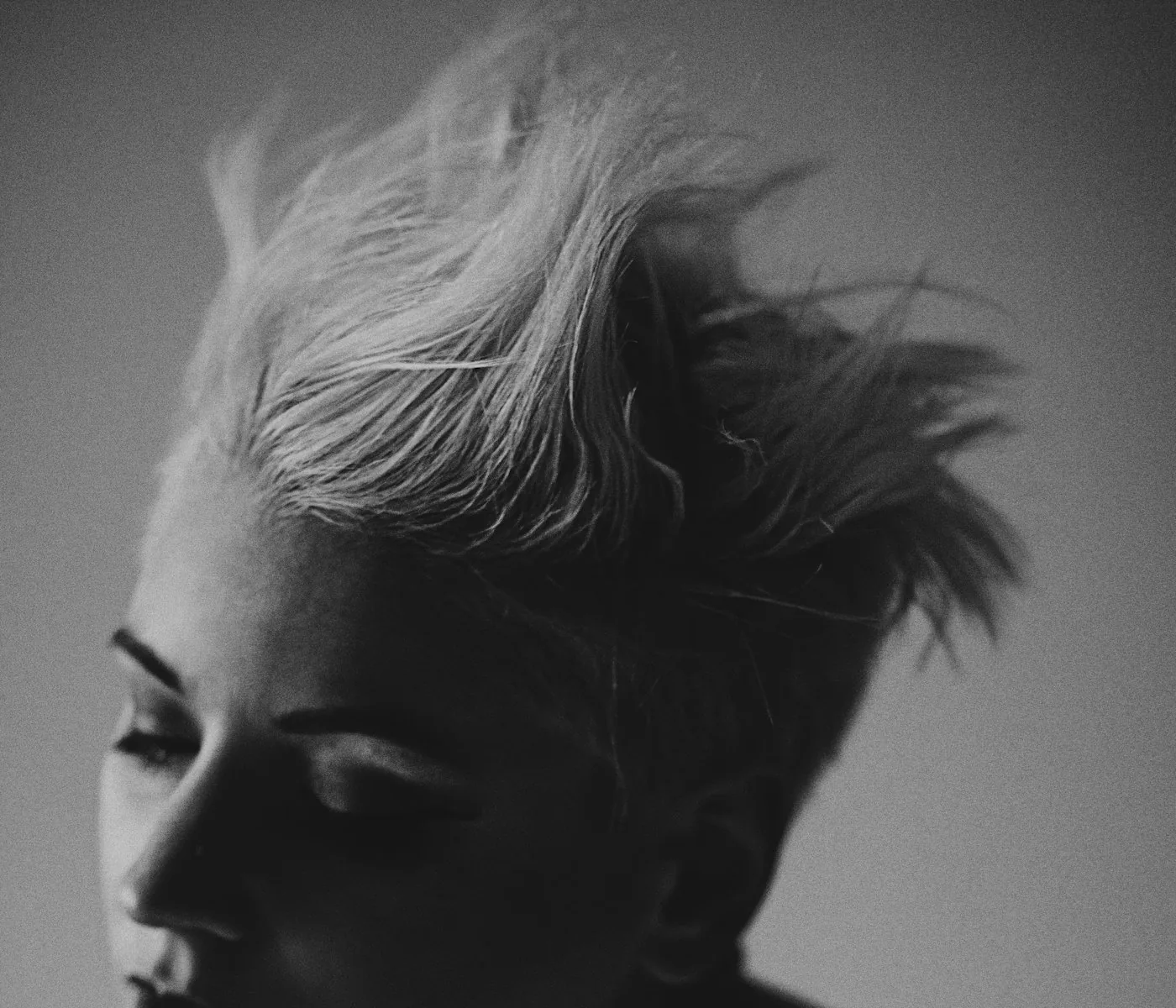 Portrait with short blonde hair in strong light