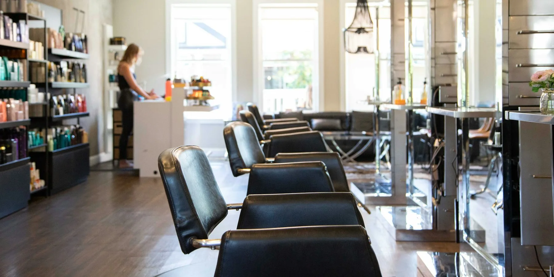 Row of styling chairs in a CULT MANE salon
